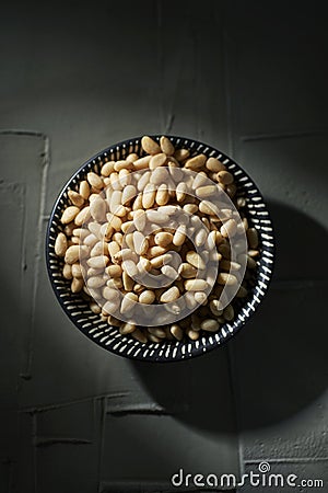 Shelled pine nuts in a bowl Stock Photo