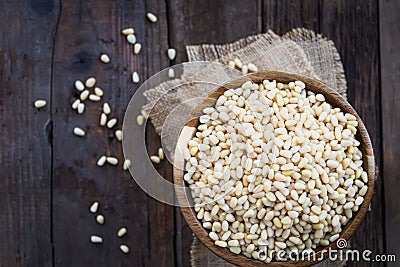 Shelled Raw Pine Nuts in the Wooden Bowl Stock Photo
