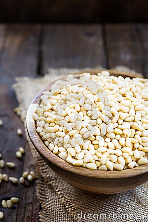 Shelled Raw Pine Nuts in the Wooden Bowl Stock Photo