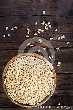 Shelled Raw Pine Nuts in the Wooden Bowl Stock Photo