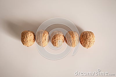 Shelled walnuts. Being smart vs. stupid. Accurate solutions lead to success, efficiency, smartness, cleverness let you avoid Stock Photo