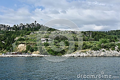 Sheltered Beach and Park Behind Rocky Jetty on the Dalmatian Coast of Croatia Stock Photo