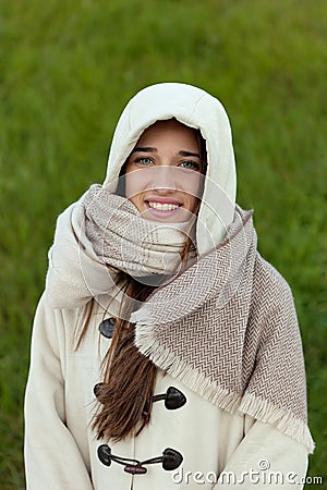 Sheltered girl with hood and scarf Stock Photo