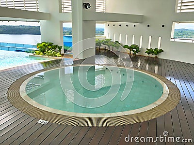 Sheltered round jacuzzi pool with sea view Stock Photo