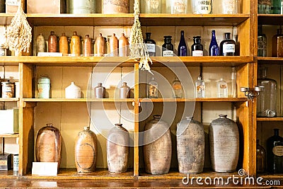 Shelves with ancient earthenware and glass vessels. Stock Photo