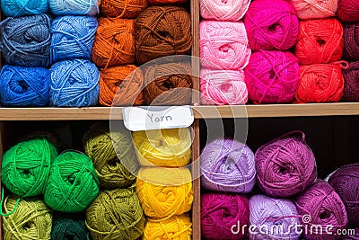 Shelves with colorful yarn balls in store Stock Photo