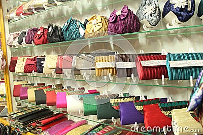 Shelves filled with ladies shiny hand bags Stock Photo