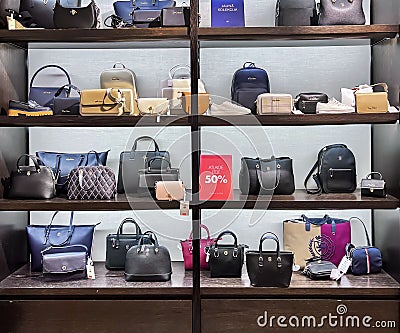 Shelves with Guess fashion bags on sale with big discounts Editorial Stock Photo