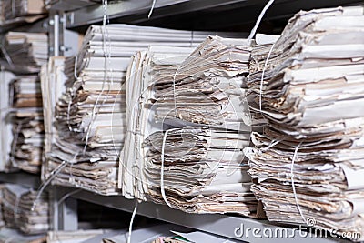 shelves with paper documents. Organized office space with neatly arranged paper documents and file cabinets Stock Photo