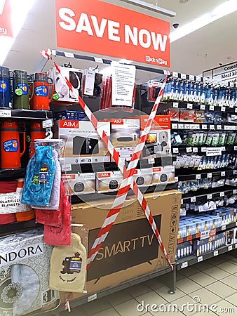 Shelves with prohibited to sell goods closed with tape PicknPay supermarket Editorial Stock Photo