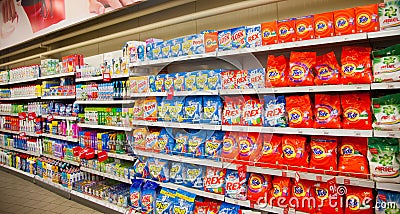 : Shelves of supermarket with washing powders and cleaning detergents. Editorial Stock Photo