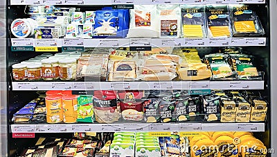 Shelves with a various cheeses from different manufacturers Editorial Stock Photo