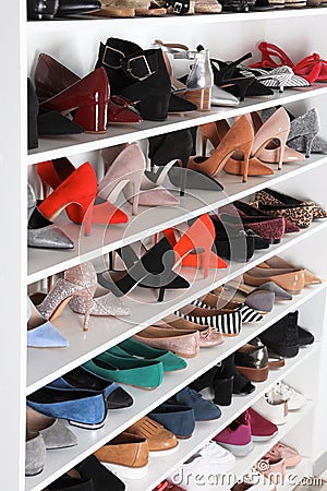 Shelving unit with different shoes Stock Photo