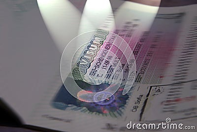 Shengen visa stamp in international passport. Schengen document for pass customs control on border of a country. Document for trav Stock Photo