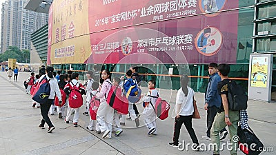 Shenzhen, China: children athletes walk past the sports square to take part in a competition Editorial Stock Photo