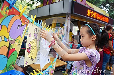 Shenzhen, China: children painting sale to help the people in trouble Editorial Stock Photo