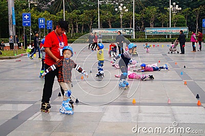Shenzhen, China: children practice roller skating Editorial Stock Photo