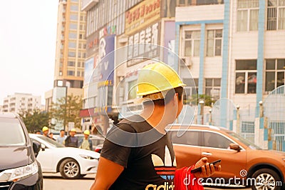 Shenzhen, China: construction workers Editorial Stock Photo