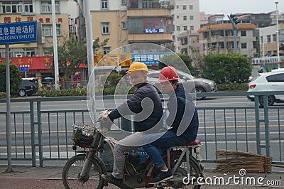 Shenzhen, China: construction workers Editorial Stock Photo