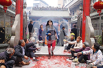 Shenzhen, China: in the gate of the temple are beggars Editorial Stock Photo