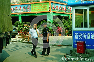 Shenzhen, China: male security guards on duty Editorial Stock Photo