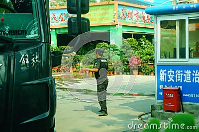 Shenzhen, China: male security guards on duty Editorial Stock Photo