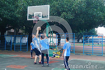 Shenzhen, China: middle school students playing basketball Editorial Stock Photo