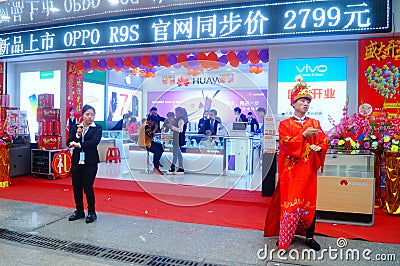 Shenzhen, China: mobile phone stores opened, Sun Wukong and young women dancing to attract customers Editorial Stock Photo