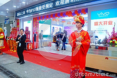 Shenzhen, China: mobile phone stores opened, Sun Wukong and young women dancing to attract customers Editorial Stock Photo