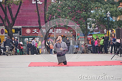 Shenzhen, China: people with disabilities in the singing and begging Editorial Stock Photo