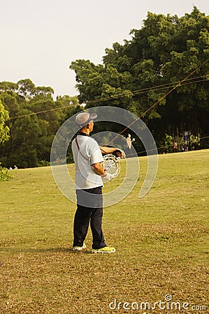 Shenzhen, China: people flying kites Editorial Stock Photo