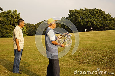 Shenzhen, China: people flying kites Editorial Stock Photo