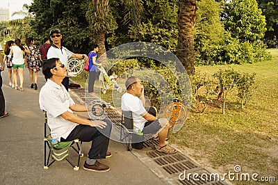 Shenzhen, China: people flying kites Editorial Stock Photo