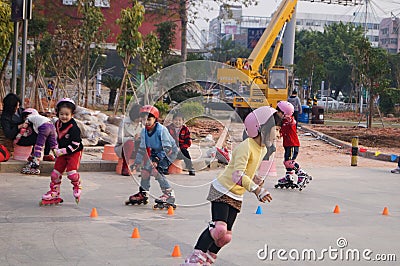 Shenzhen, China: playing pulley children Editorial Stock Photo
