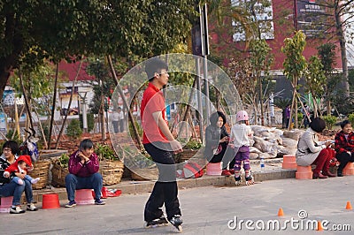 Shenzhen, China: playing pulley children Editorial Stock Photo