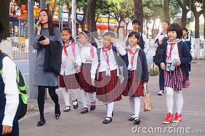 Shenzhen, China: students walk home after school Editorial Stock Photo