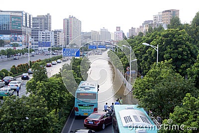 Shenzhen china: underground water pipes burst, water flow into the river Editorial Stock Photo