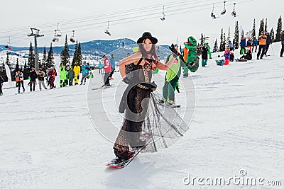 Sheregesh, Kemerovo region, Russia - April 03, 2021: Grelka Fest in Sheregesh. People in carnival costumes on the snow Editorial Stock Photo