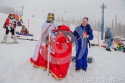 Sheregesh, Kemerovo region, Russia - April 06, 2019: Young women in carnival costumes of witches on the mountain slope Editorial Stock Photo