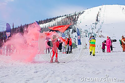 Sheregesh, Kemerovo region, Russia - April 12, 2019: Young happy pretty woman dressed in carnival costume of a red devil riding on Editorial Stock Photo