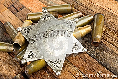 Sheriff badge and bullets shell Stock Photo