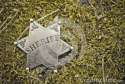 Sheriff badge on wooden background. Stock Photo
