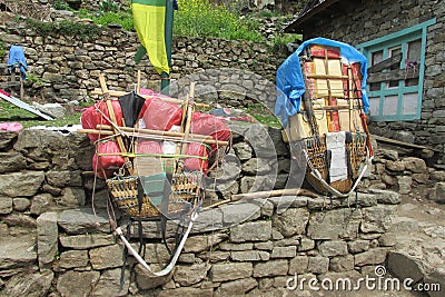 Sherpa porter basket in Nepal trekking path Editorial Stock Photo