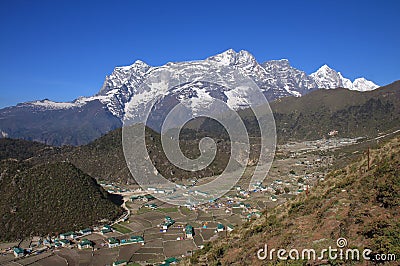 Sherpa village Khumjung and high mountains Stock Photo