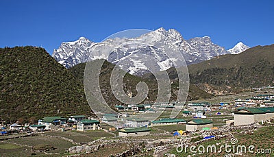 Sherpa village Khumjung and mountain Stock Photo