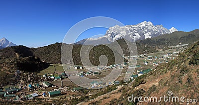 Sherpa village Khumjung and snow capped Kongde Ri Stock Photo