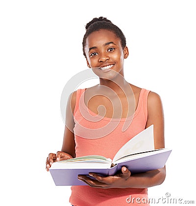 Shes an avid reader. Studio portrait of a young african american girl reading a book isolated on white. Stock Photo