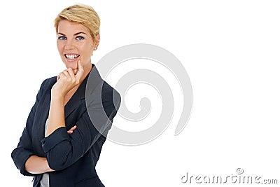 Shes just got another business idea. A young businesswoman looking thoughtful with her hand on her chin. Stock Photo