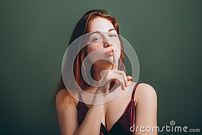 Shh silence female finger lips fixed gaze Stock Photo