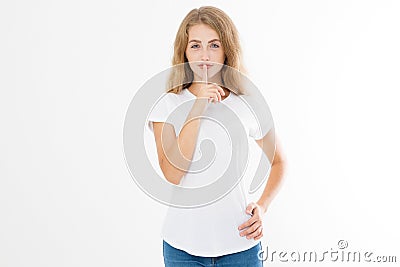 Shhh sign. Young woman showing shh gesture to keep a silent. Girl in template white t shirt keep a secret. Quiet place and silence Stock Photo